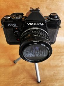 Yashica FX-D Quartz compact, manual-focus 35mm SLR film camera + 3 lenses.