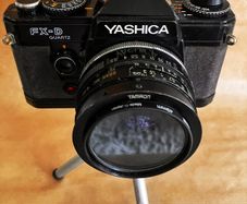 Yashica FX-D Quartz compact, manual-focus 35mm SLR film camera + 3 lenses.