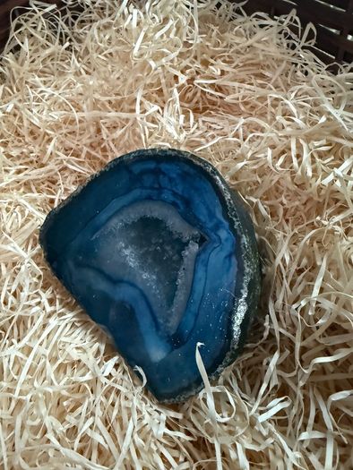 Polished blue agate geode slice.