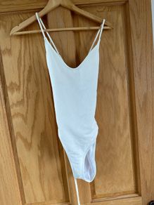 white swimsuit by Wolf & Whistle