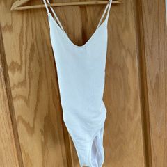 white swimsuit by Wolf & Whistle