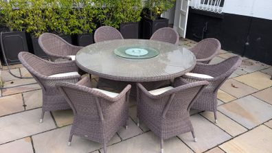 Rattan garden dining set with glass top table and 8 chairs