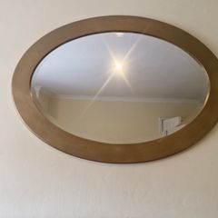 oval gold mirror