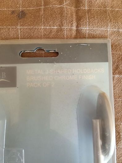 LBB metal J-shaped curtain holdbacks in a brushed chrome finish