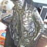 Large Cowboy Sculpture is titled Cutting the Dust and was created by artist Michael Garman. It is a Western Themed piece featuring a Cowboy Leaning Against a Counter, Image 2