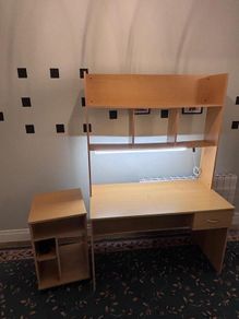 Desk with bookshelf and light