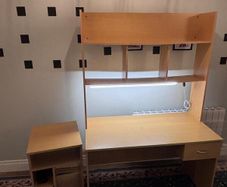 Desk with bookshelf and light