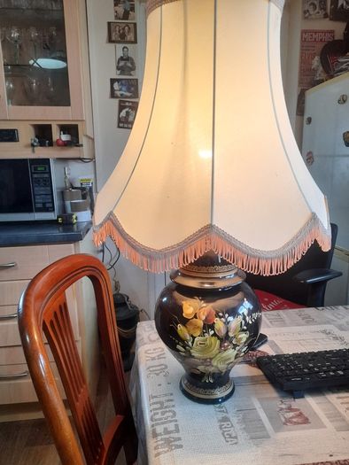 Beautiful Old Large Creamic Table Lamp  Hand Painted Floral Motifs Decorative Chinoiserie Inspired, and a Cream Colored Fabric Shade with Fringed Edging.