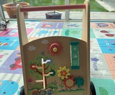 Two baby walkers - Fisher-Price Zebra and wooden activity walker
