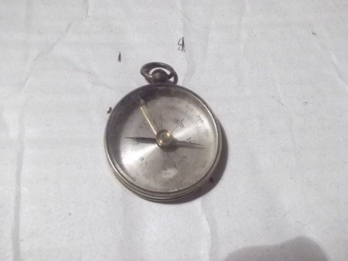 a  antique pocket compass  working