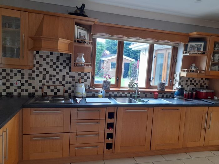 Solid oak kitchen shaker style American style samsung fridge freezer and electric hob.