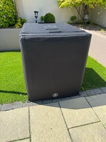 Yamaha DXS18XLF subwoofer with cover and castors