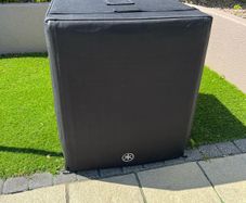 Yamaha DXS18XLF subwoofer with cover and castors