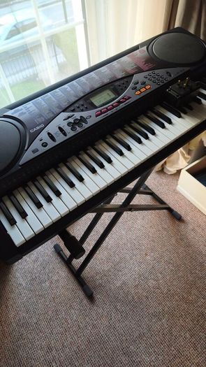 Casio keyboard LK 50 with a stand