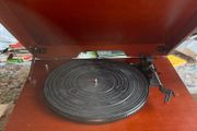 Record player for sale. Free Postage In perfect working order. New drive belt fitted plus 1 spare. New stylus fitted. 3 speed push button controls. AM/Fm radio. In a very nice red walnut case.