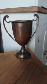 historical bronze golfing trophy