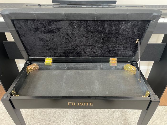 piano, bench and audio transmitter