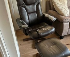 Brown Leather armchair and matching footstool