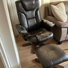 Brown Leather armchair and matching footstool