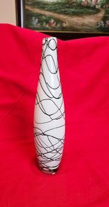 A decorative glass vase made of blown art glass, resembling a bottle in Murano style. Ornament