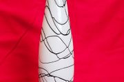 A decorative glass vase made of blown art glass, resembling a bottle in Murano style. Ornament