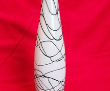 A decorative glass vase made of blown art glass, resembling a bottle in Murano style. Ornament