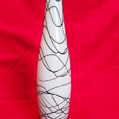 A decorative glass vase made of blown art glass, resembling a bottle in Murano style. Ornament