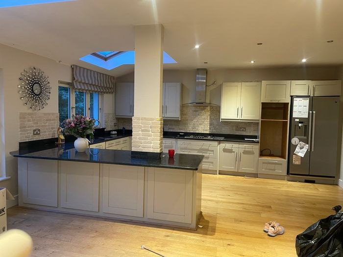 Entire kitchen Quartz work top solid wooden shaker style doors