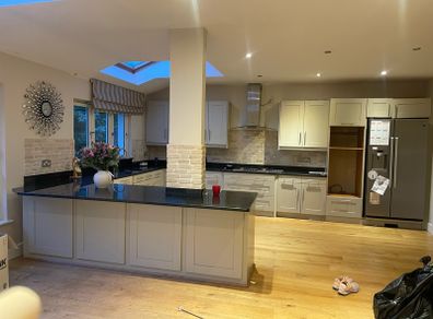 Entire kitchen Quartz work top solid wooden shaker style doors
