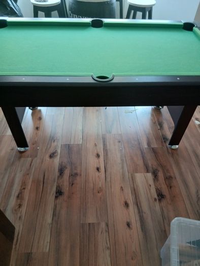 Pool table with cues and balls