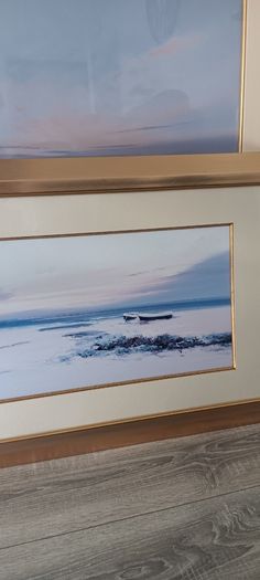 Two gold frame pictures with boats