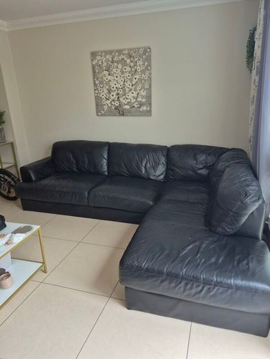 Black leather corner sofa and recliner chair
