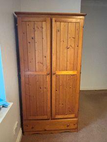 Pine wooden wardrobe. Both side hanging. Drawer underneath.
