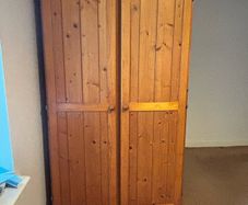 Pine wooden wardrobe. Both side hanging. Drawer underneath.