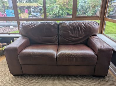 Brown faux-leather two-seater sofa