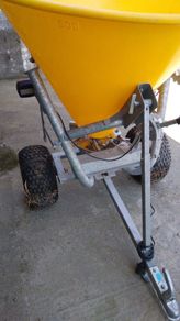 Quad and fertilizer spreader