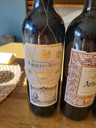 Full unopened wine bottles for display