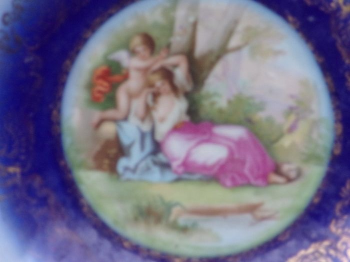 a large antique round plaque signed.kauffman