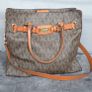 Michael Kors brown signature large handbag with shoulder strap. Spacious interior with multiple pockets. In perfect condition apart from one small tear, as shown in the photo. Image 3