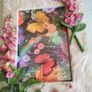BUTTERFLIES picture framed in stone finish frame edged with flowers. Image 2
