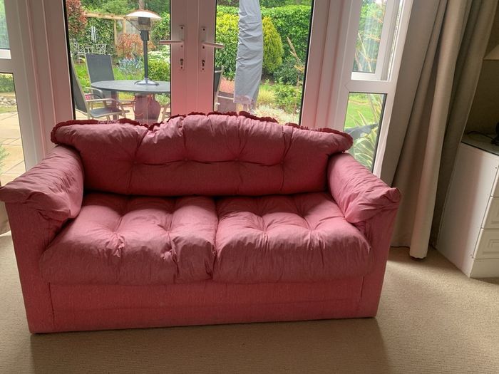 A pretty pink sofa bed, ideal for sleepovers in a girls bedroom. Very good condition