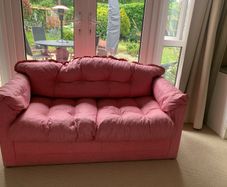 A pretty pink sofa bed, ideal for sleepovers in a girls bedroom. Very good condition