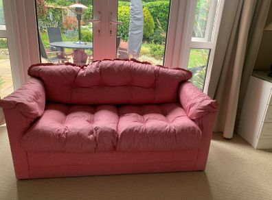 A pretty pink sofa bed, ideal for sleepovers in a girls bedroom. Very good condition
