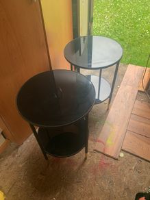 Two black glass tables