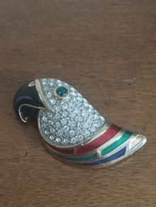 Beautiful vintage parrot brooch covered with rhinestones with enamel accents.