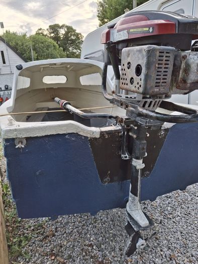 Small boat with engine and trailer