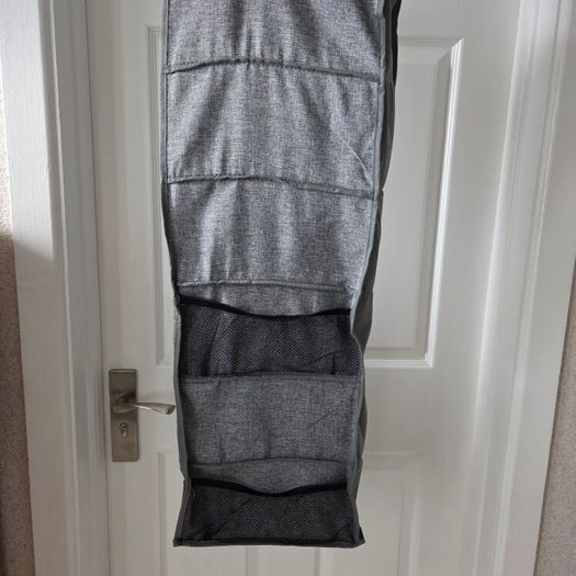 Grey fabric hanging closet organizer with 6 open shelves and side mesh pockets