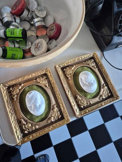 A pair of MidCentury Kelgin wall hanging Plaster  Vintage decorative pair of wall plaques featuring plaster cameos on green velvet background with ornate gold relief plaster frames