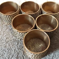 six brass napkin ring's