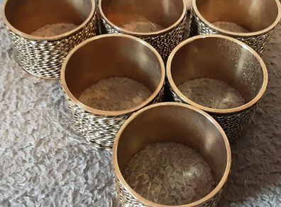 six brass napkin ring's